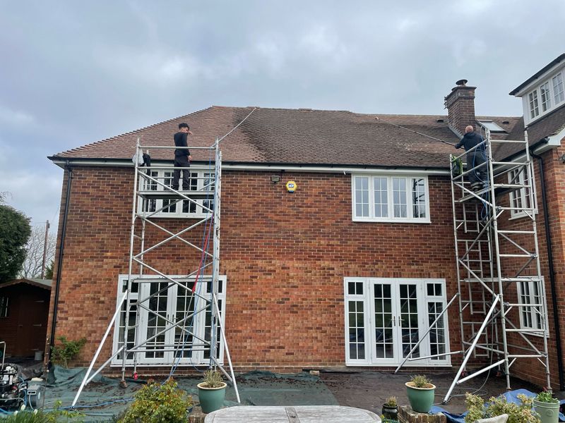 Roof cleaning carried out safely from scaffold towers by The Roof Moss Cleaners in Burton Latimer